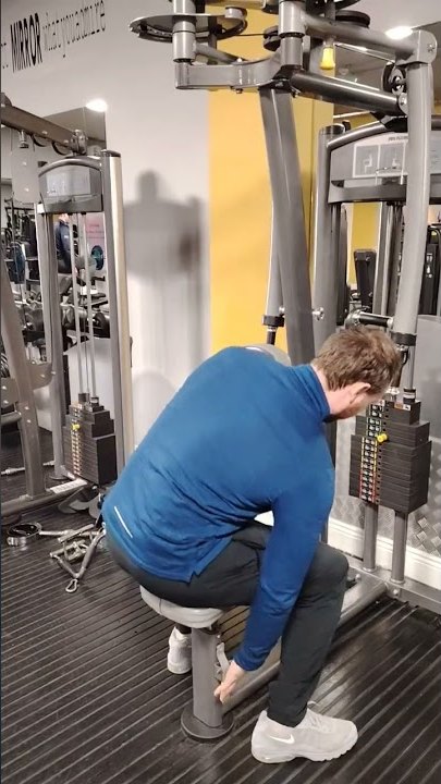 Row of selectorised weight machines with yellow frames